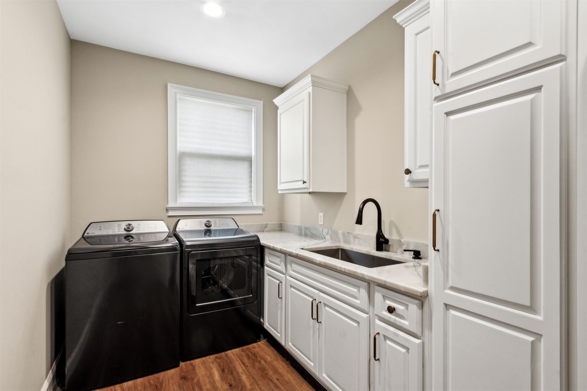 37854 Kings Ferry Road Hilliard, FL 32046 - Photo 44 of 52 a kitchen with granite countertop a sink stainless steel appliances and cabinets