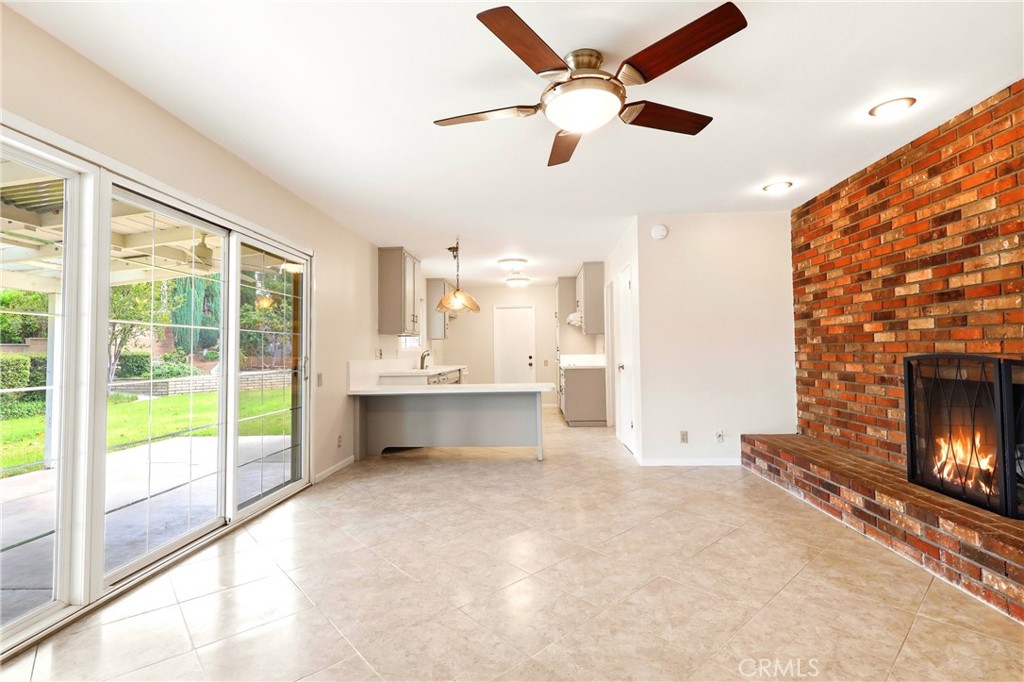 2145 Fairview Avenue Riverside, CA 92506 - Photo 15 of 35 a view of an empty room with a fireplace and a large window