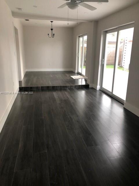 Flagami Miami, FL 33144 - Photo 3 of 4 an empty room with wooden floor and windows