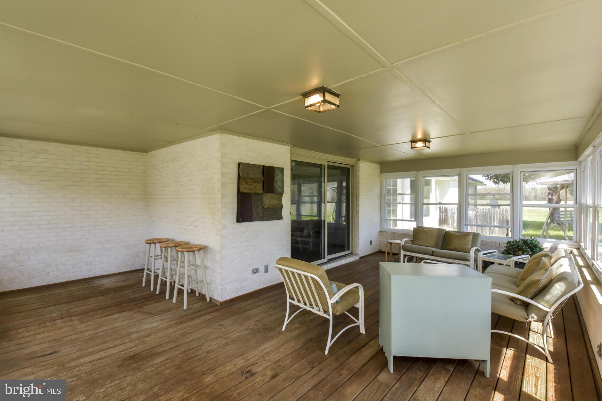 1901 Lowery Road Huntingtown, MD 20639 - Photo 14 of 30 a view of a dining room with furniture and wooden floor