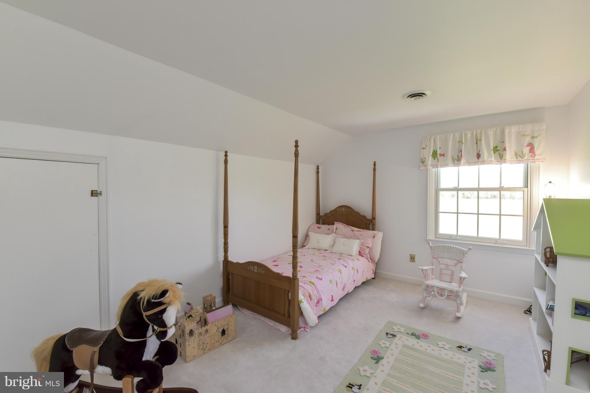 1901 Lowery Road Huntingtown, MD 20639 - Photo 21 of 30 a bedroom with a bed and a window