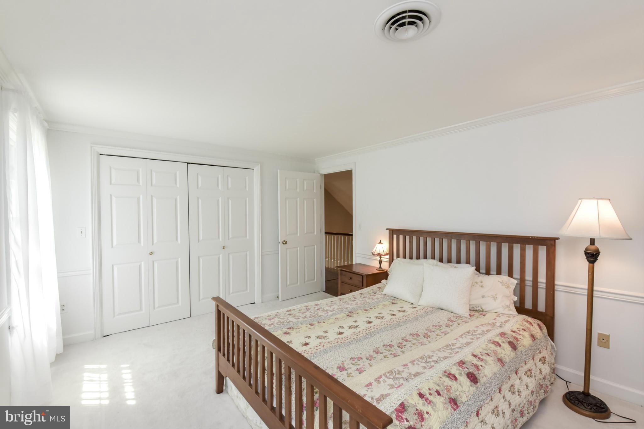 1901 Lowery Road Huntingtown, MD 20639 - Photo 22 of 30 a bedroom with a bed and a window