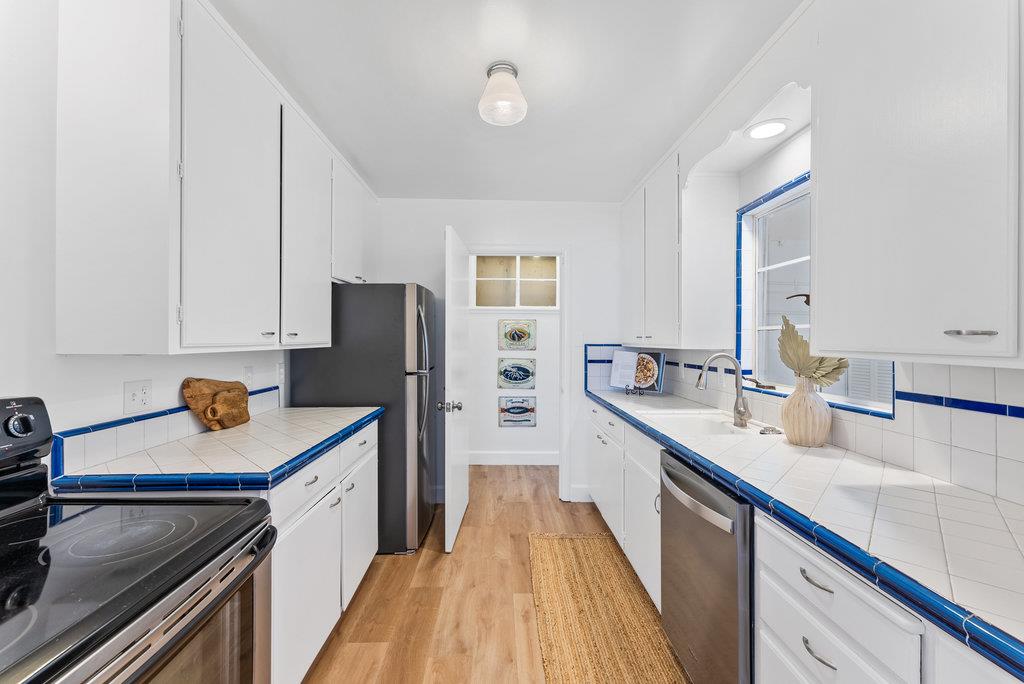 403 Beach Drive Aptos, CA 95003 - Photo 10 of 24 a kitchen with a sink stove and refrigerator