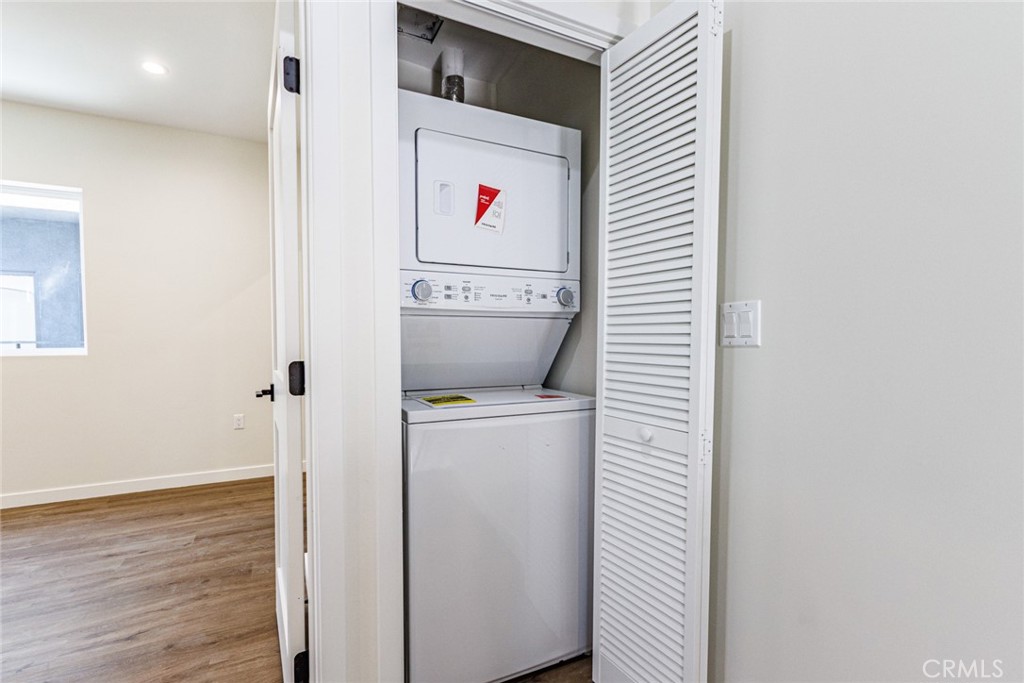 1857 Crenshaw Boulevard, Unit 1/2 Los Angeles, CA 90019 - Photo 16 of 24 a room that has a painting on the wall