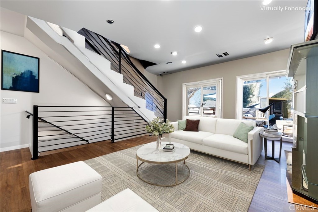 1857 Crenshaw Boulevard, Unit 1/2 Los Angeles, CA 90019 - Photo 2 of 24 a living room with furniture and a fireplace