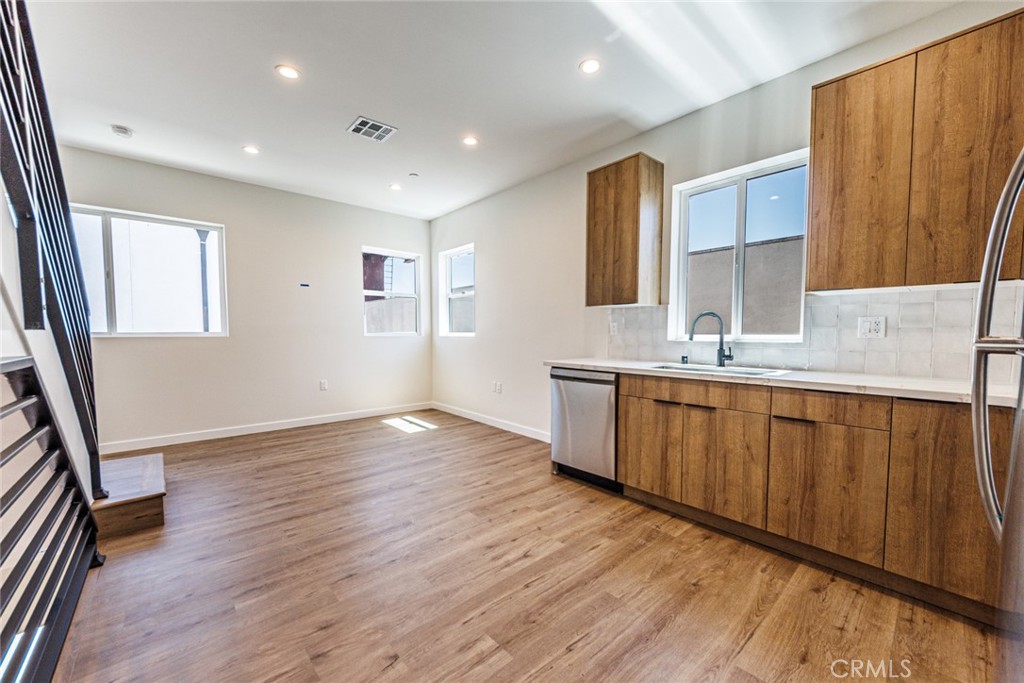 1857 Crenshaw Boulevard, Unit 1/2 Los Angeles, CA 90019 - Photo 9 of 24 a view of a kitchen with a sink and a large window