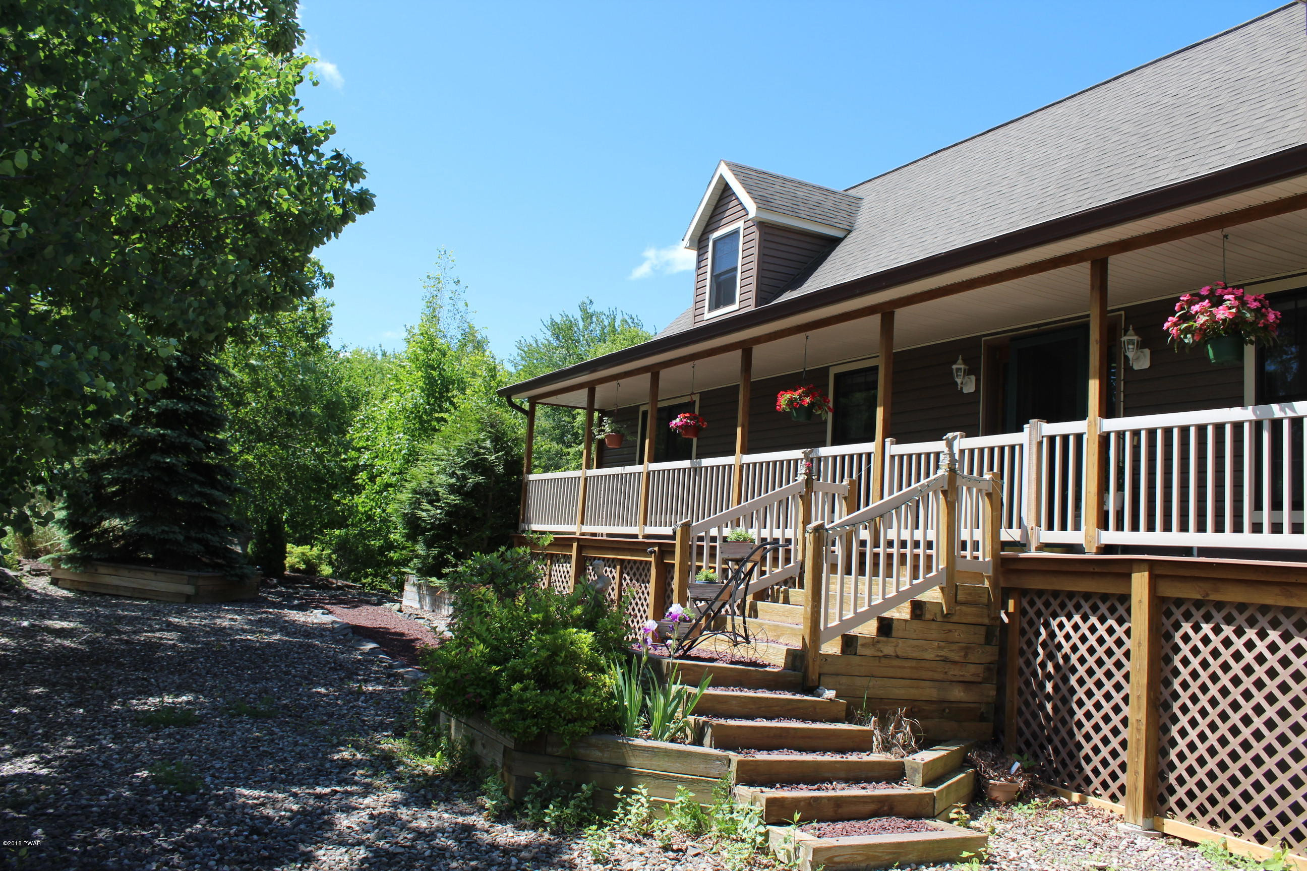 232 Maple Ridge Drive Hawley, PA 18428 - Photo 2 of 44 a view of a house with a deck
