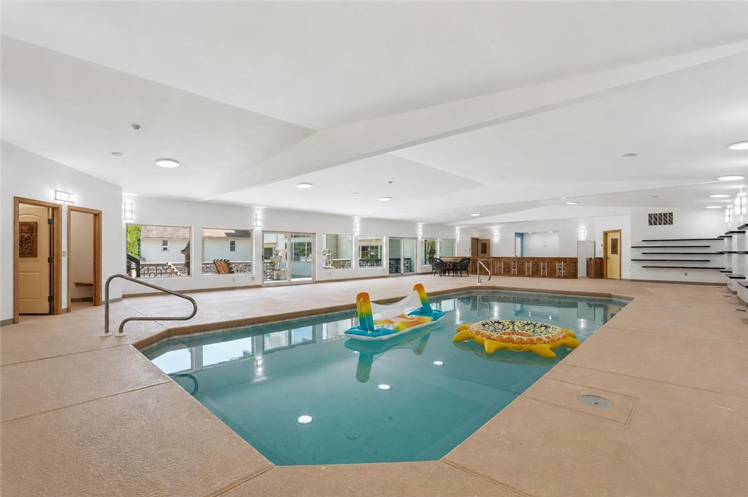 6271 Batman Road Zionsville, PA 18092 - Photo 39 of 100 An inviting indoor pool with surrounding windows offers year-round recreation and a connection to the outdoors.