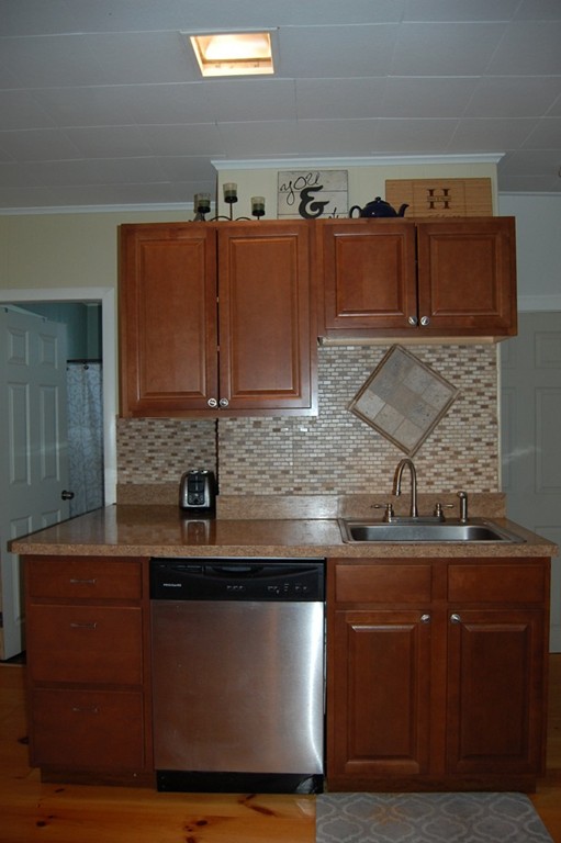 105 Gresham Street Springfield, MA 01119 - Photo 11 of 30 a kitchen with a sink and cabinets