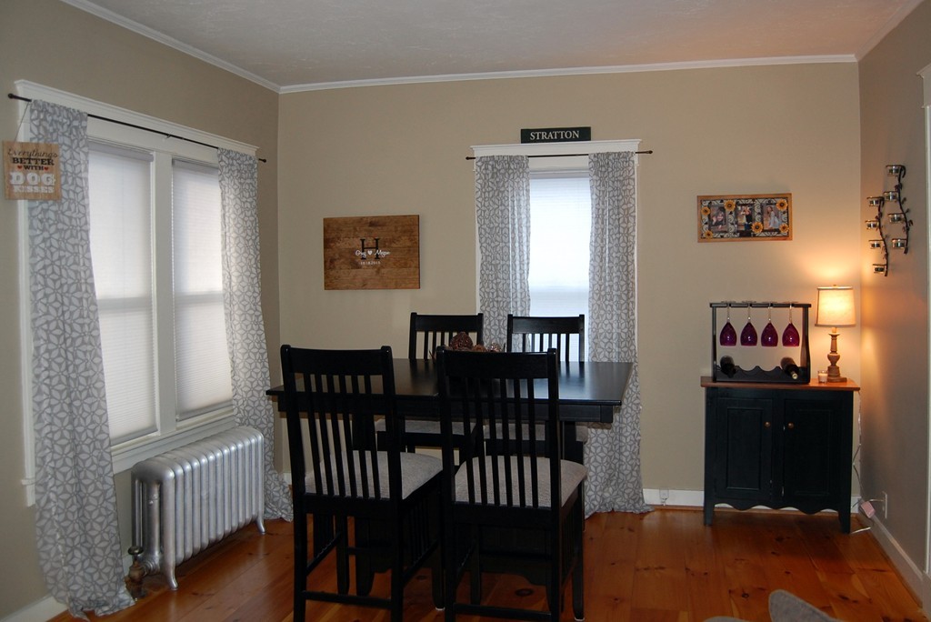 105 Gresham Street Springfield, MA 01119 - Photo 14 of 30 a view of a dining room with furniture and wooden floor
