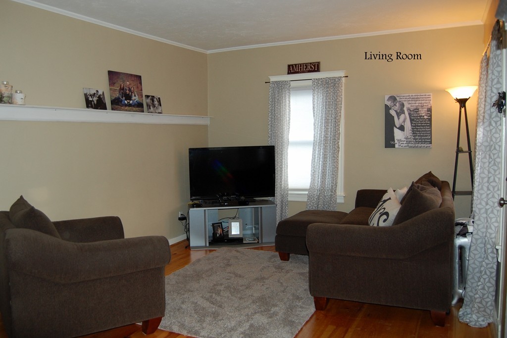 105 Gresham Street Springfield, MA 01119 - Photo 16 of 30 a living room with furniture and a flat screen tv