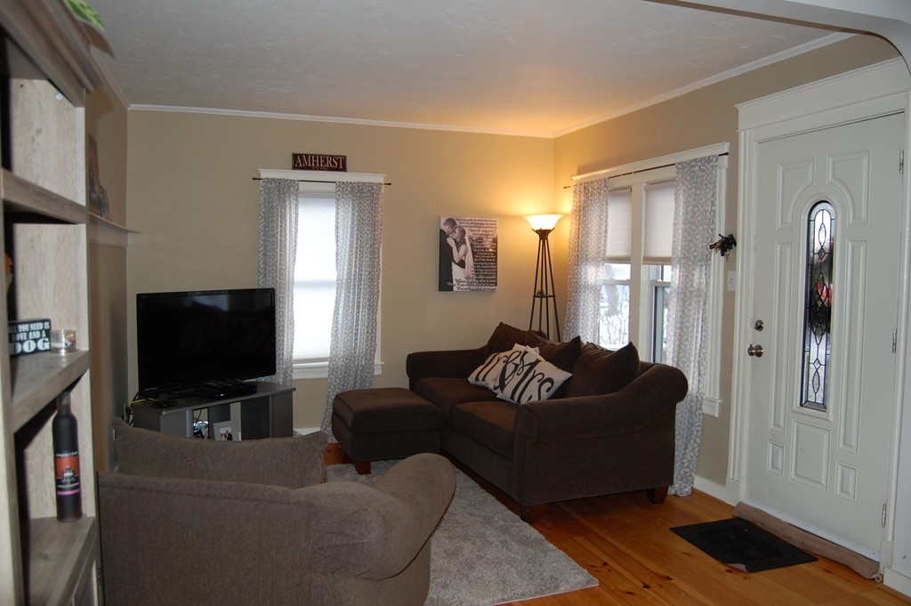 105 Gresham Street Springfield, MA 01119 - Photo 17 of 30 a living room with furniture and a flat screen tv