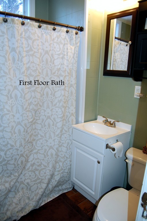 105 Gresham Street Springfield, MA 01119 - Photo 18 of 30 a bathroom with a sink a toilet and a mirror