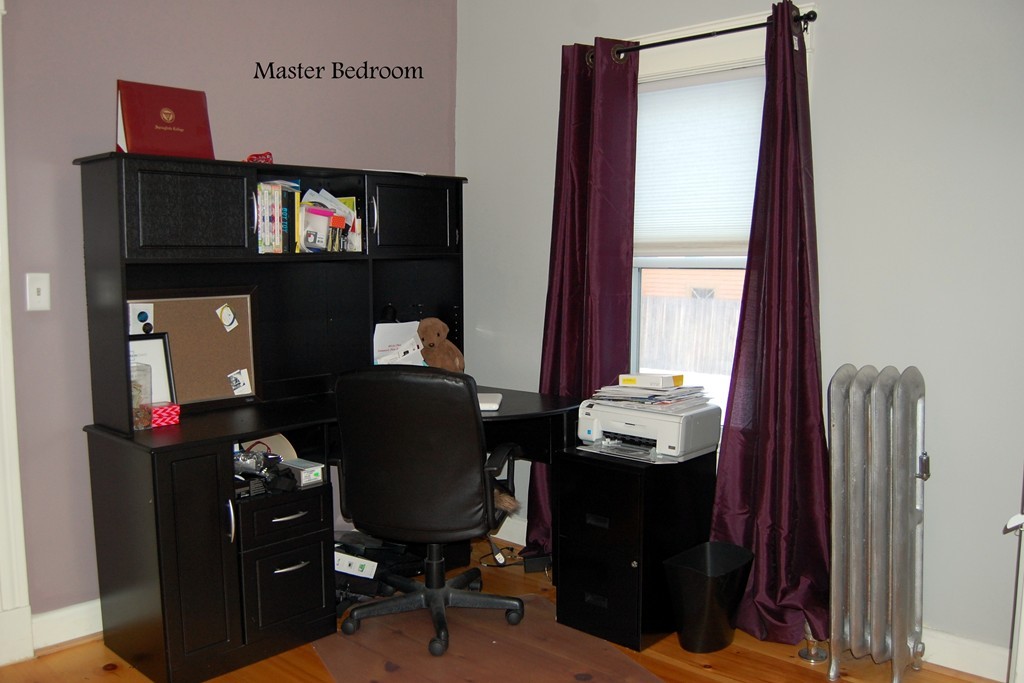 105 Gresham Street Springfield, MA 01119 - Photo 20 of 30 a view of a workspace with furniture and a window