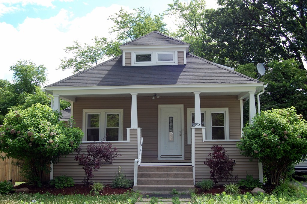 105 Gresham Street Springfield, MA 01119 - Photo 2 of 30 a front view of a house with a garden