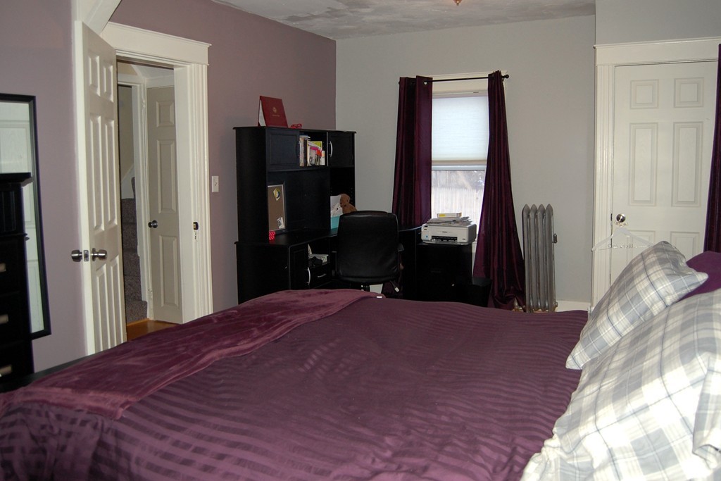 105 Gresham Street Springfield, MA 01119 - Photo 21 of 30 a bedroom with a bed and a window