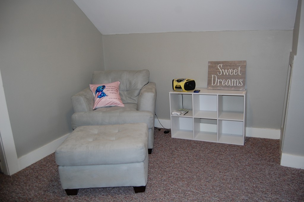 105 Gresham Street Springfield, MA 01119 - Photo 26 of 30 a living room with closet and cabinet