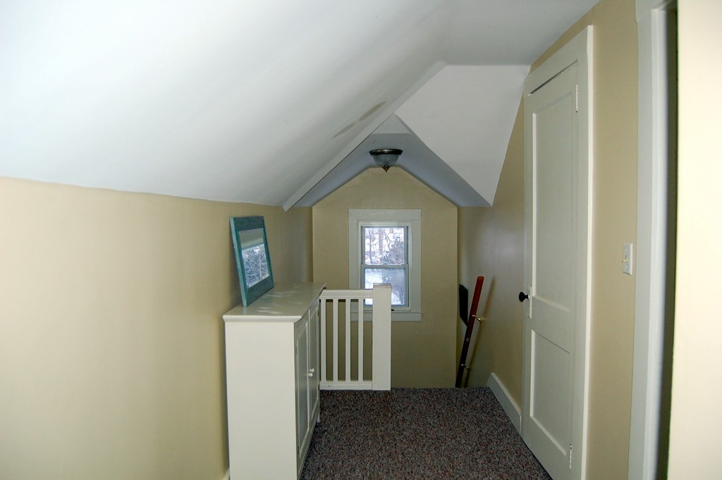 105 Gresham Street Springfield, MA 01119 - Photo 29 of 30 a view of hallway with sink and wooden floor