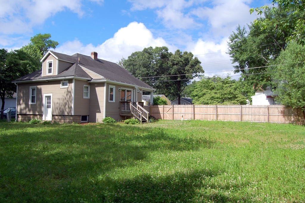 105 Gresham Street Springfield, MA 01119 - Photo 5 of 30 a view of a yard in front of a house with plants and large tree