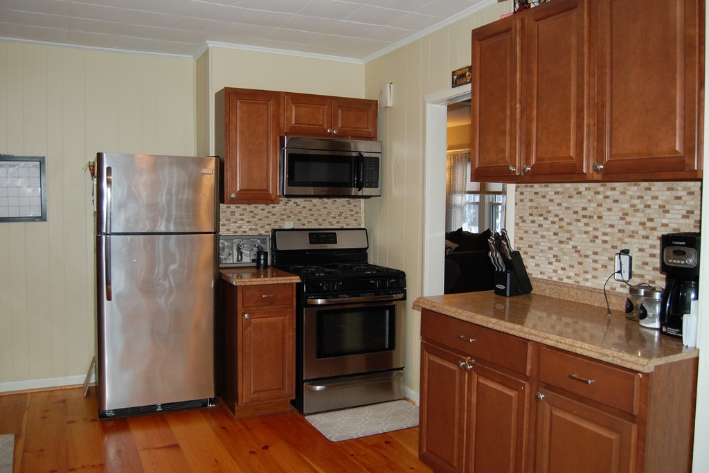105 Gresham Street Springfield, MA 01119 - Photo 7 of 30 a kitchen with a refrigerator stove and sink