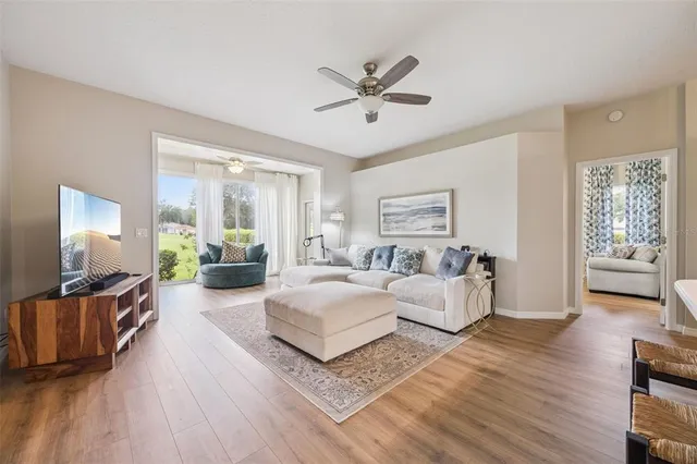 a view of a balcony with lake and outdoor seating