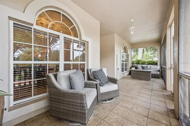 a view of a livingroom with workspace and a window