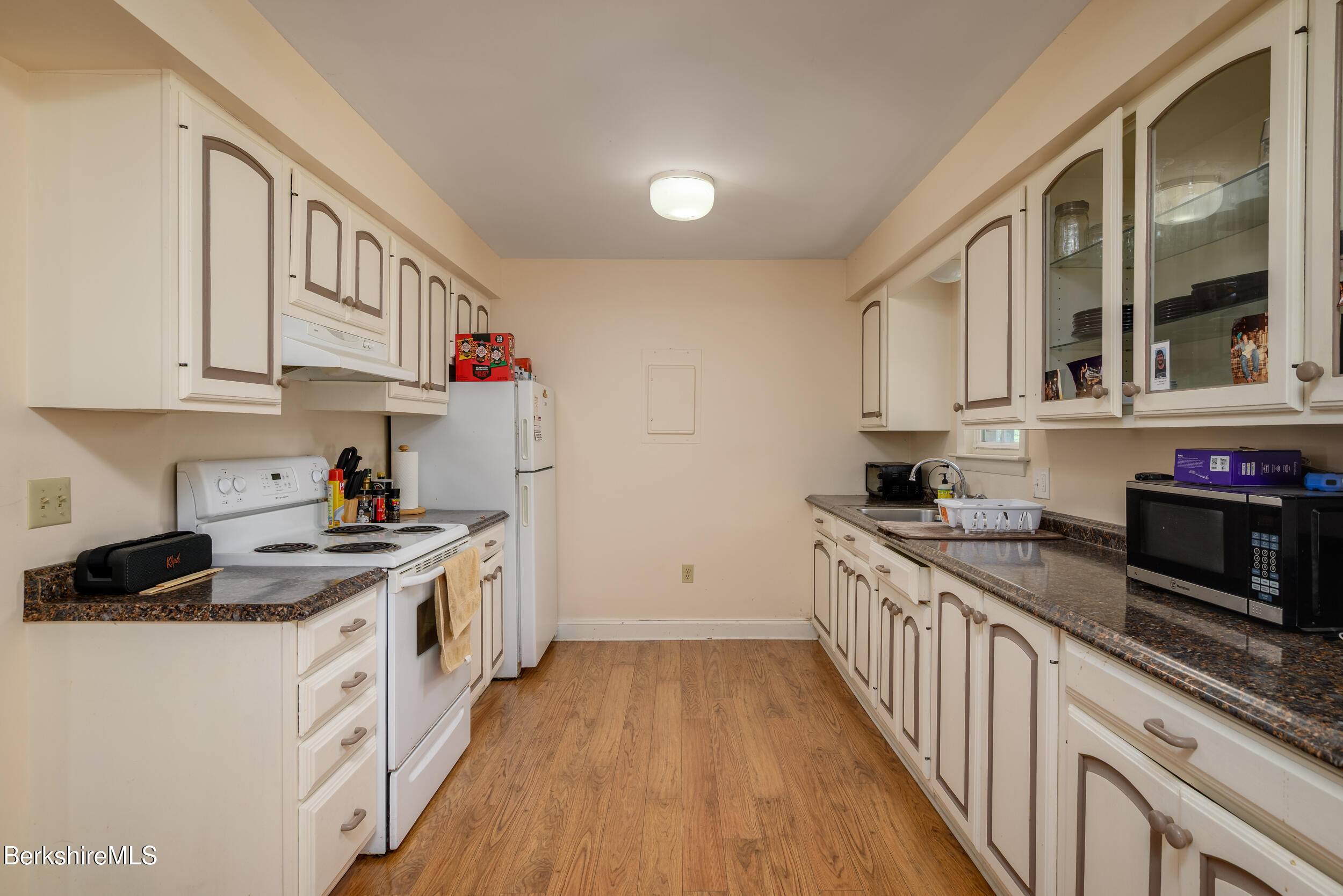 25-29 New Ashford Road Williamstown, MA 01267 - Photo 9 of 13 a kitchen with stainless steel appliances granite countertop a stove and a sink