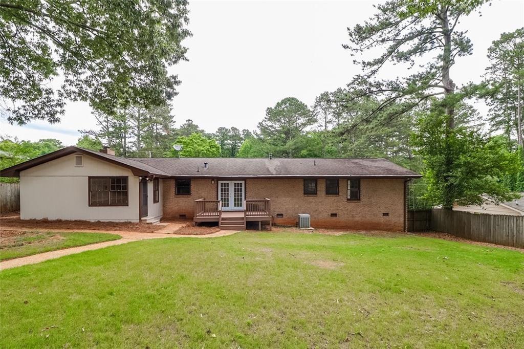 1291 Stephens Street Southwest Lilburn, GA 30047 - Photo 4 of 22 a house view with a sitting space garden and patio