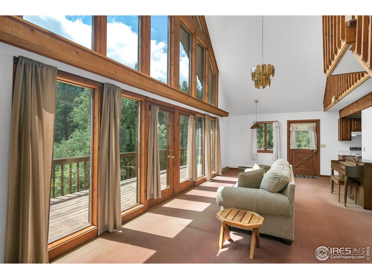 1052 Streamside Drive Drake, CO 80515 - Photo 11 of 31 a living room with furniture and a window
