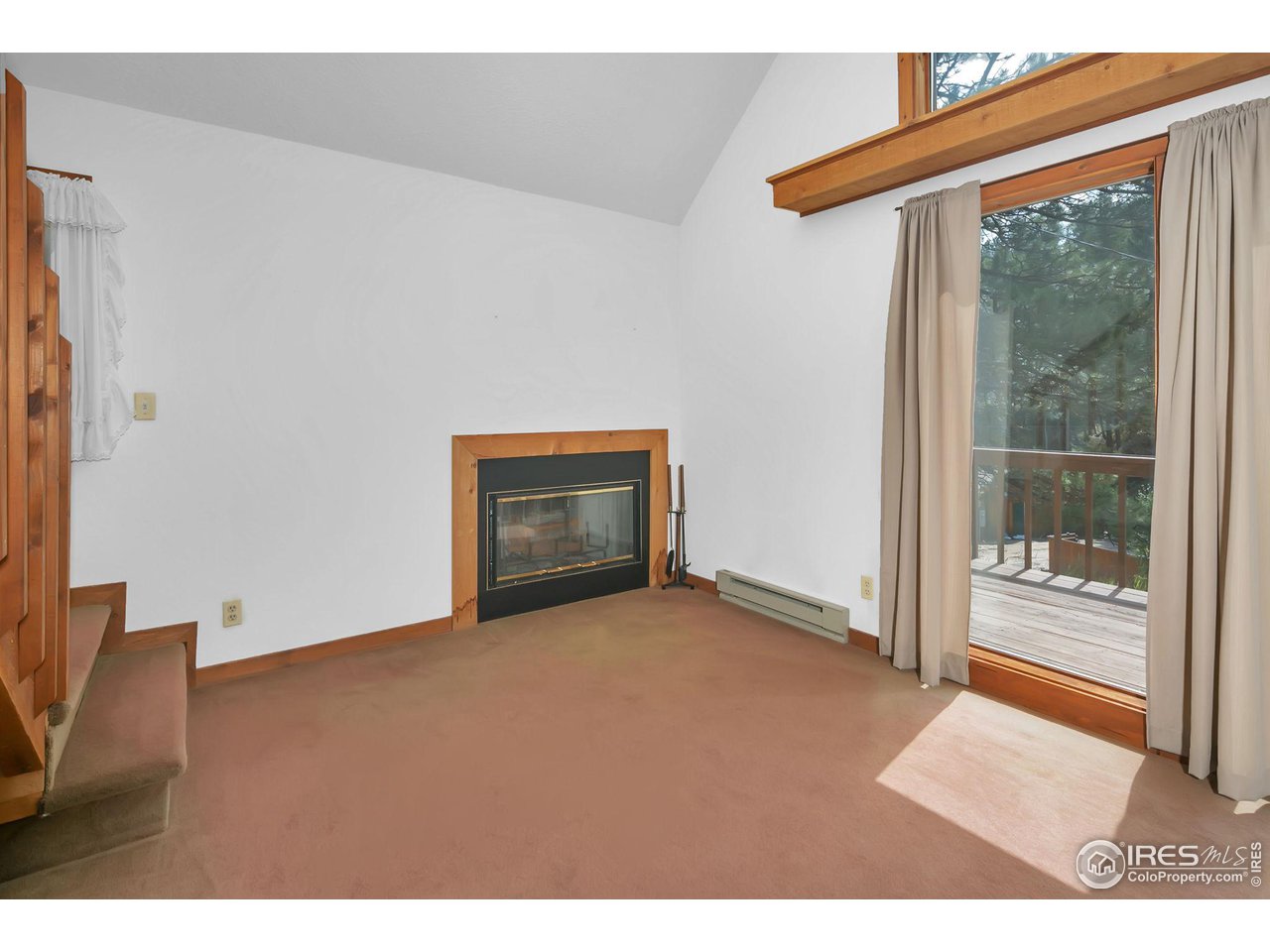 1052 Streamside Drive Drake, CO 80515 - Photo 12 of 31 a view of an empty room with a fireplace