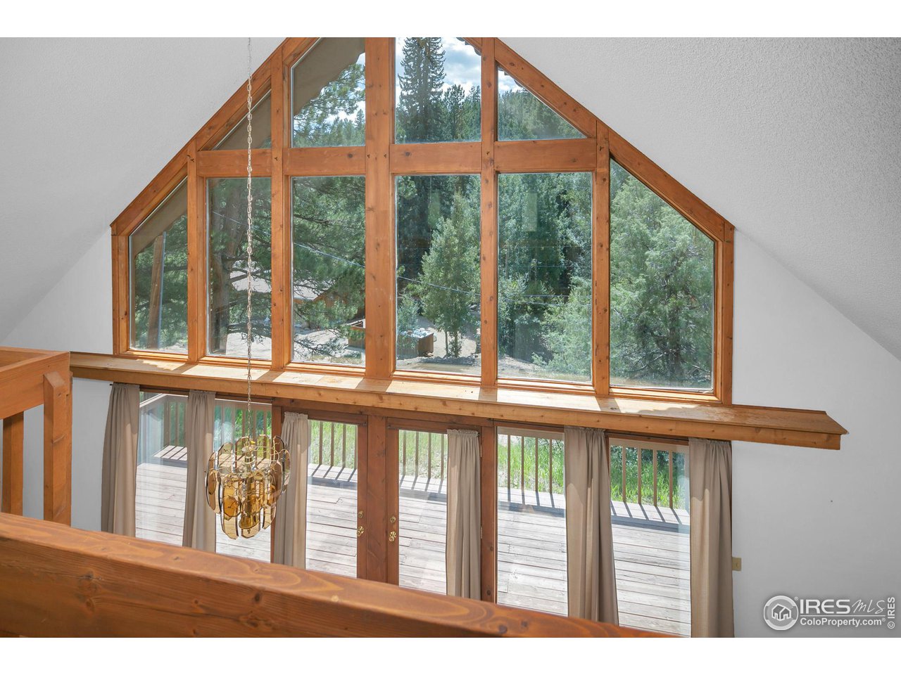 1052 Streamside Drive Drake, CO 80515 - Photo 20 of 31 a view of a large window with an outdoor space