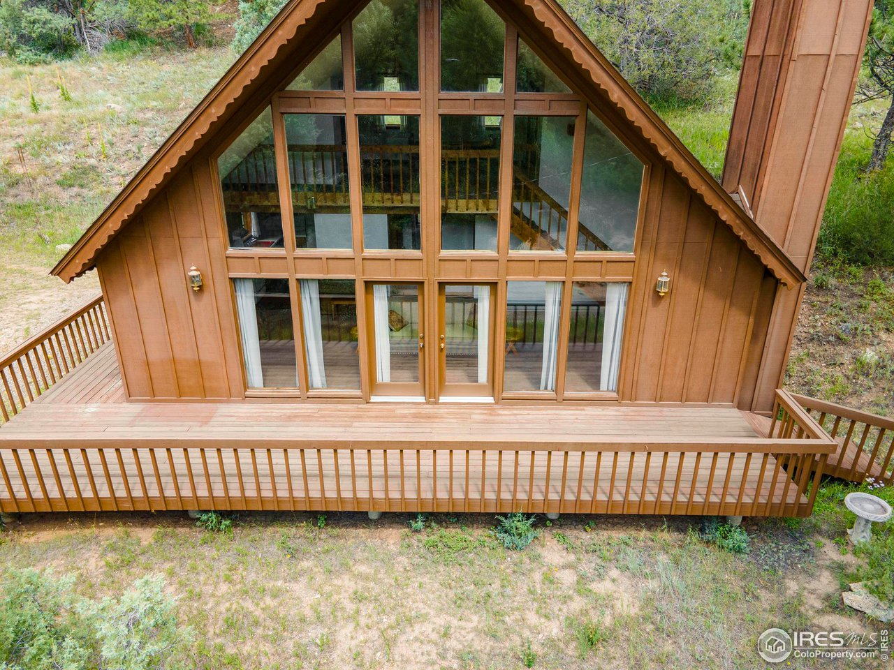 1052 Streamside Drive Drake, CO 80515 - Photo 21 of 31 a view of a house with a window and wooden floor