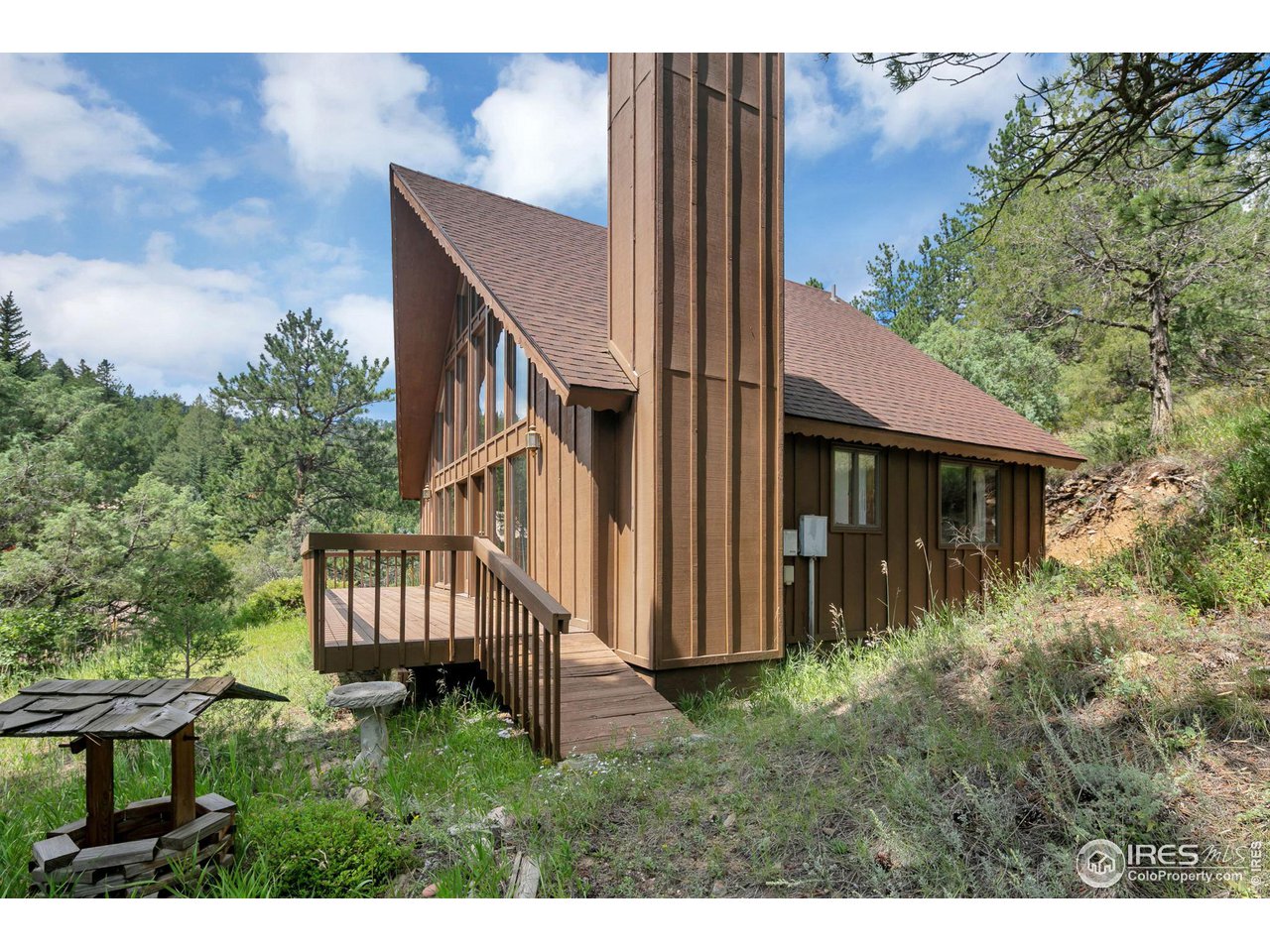 1052 Streamside Drive Drake, CO 80515 - Photo 24 of 31 a view of front of house with a yard