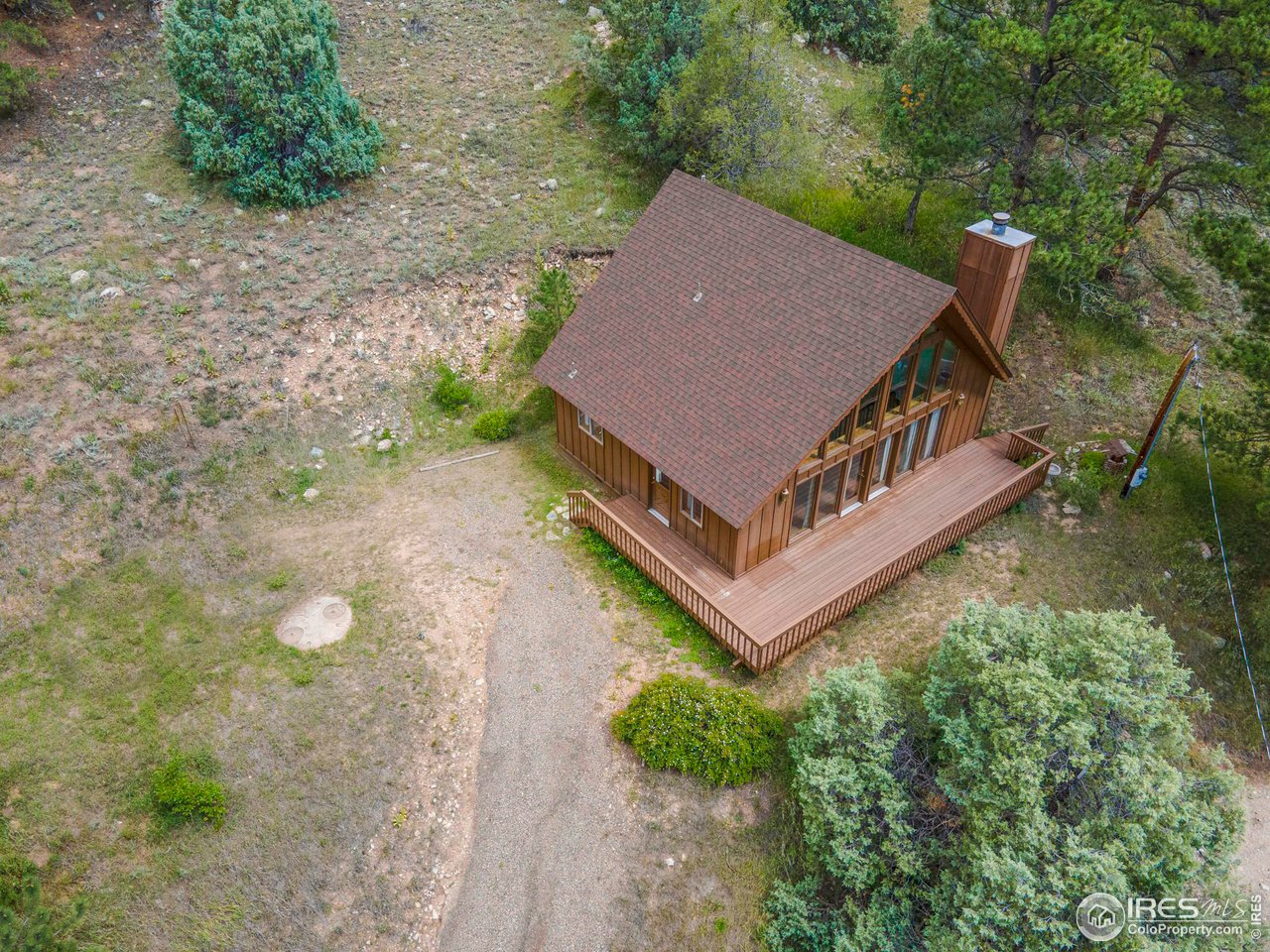 1052 Streamside Drive Drake, CO 80515 - Photo 26 of 31 an aerial view of a house with a yard