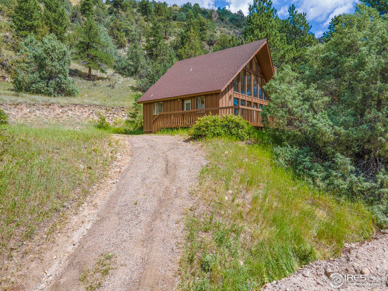 1052 Streamside Drive Drake, CO 80515 - Photo 3 of 31 a aerial view of a house with yard and green space