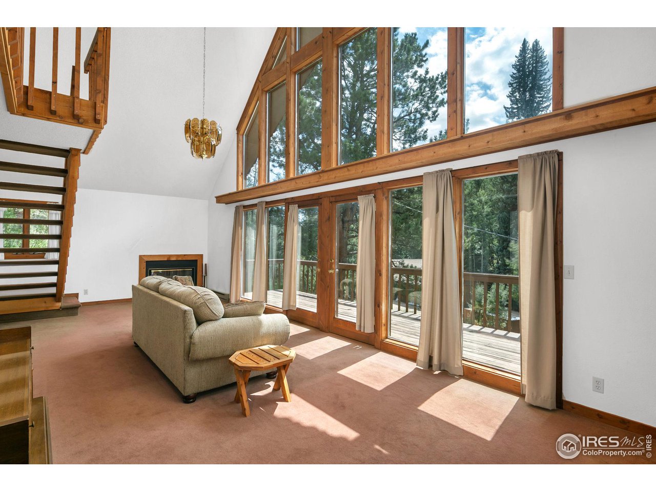 1052 Streamside Drive Drake, CO 80515 - Photo 7 of 31 a living room with furniture and a window