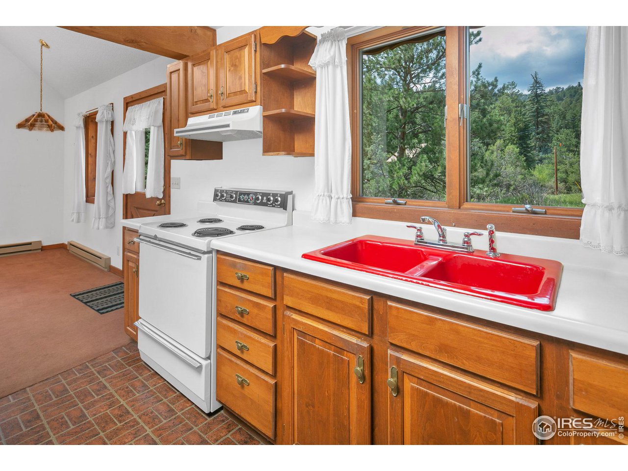 1052 Streamside Drive Drake, CO 80515 - Photo 9 of 31 a utility room with sink dryer and washer