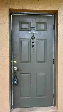 a kitchen with a stove a sink and a refrigerator