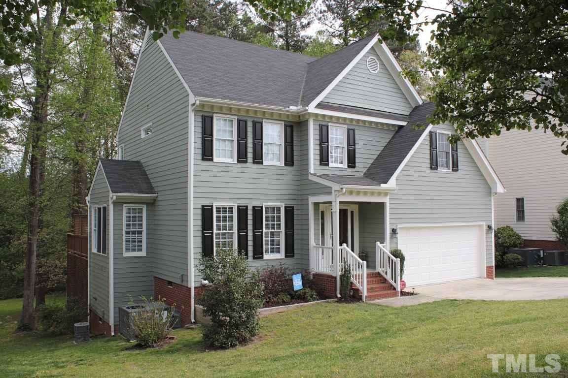 2720 Dahlgreen Road Raleigh, NC 27615 - Photo 1 of 25 a front view of a house with a yard and garage