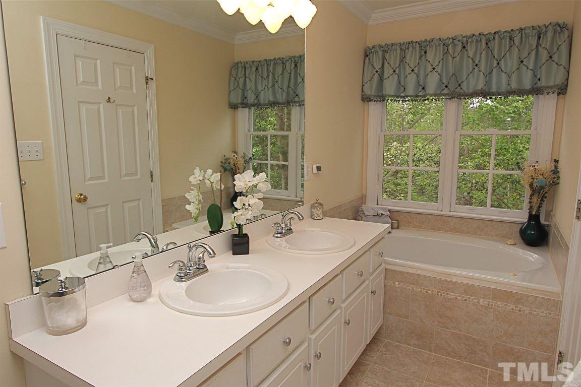 2720 Dahlgreen Road Raleigh, NC 27615 - Photo 11 of 25 a bathroom with a sink and a mirror