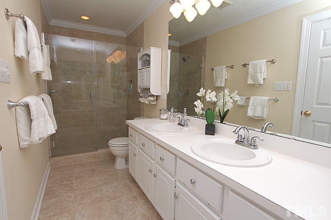 2720 Dahlgreen Road Raleigh, NC 27615 - Photo 12 of 25 a bathroom with a double vanity sink toilet and shower