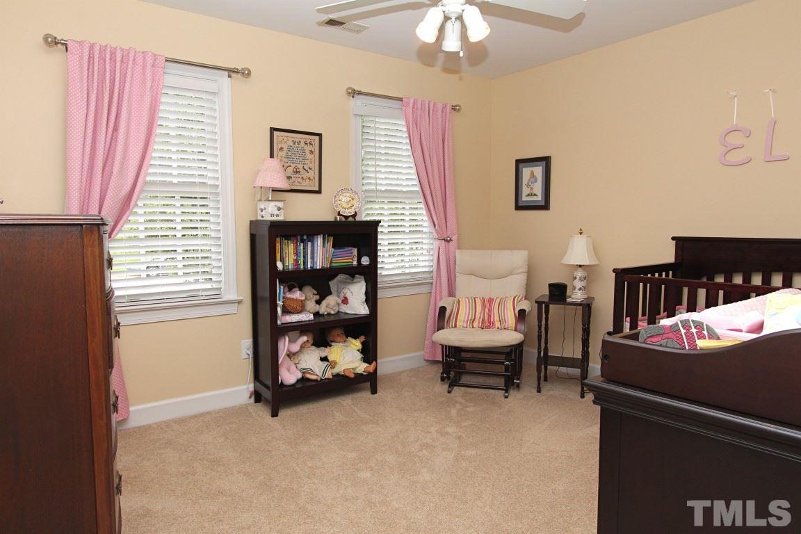 2720 Dahlgreen Road Raleigh, NC 27615 - Photo 13 of 25 a bedroom with furniture and a window