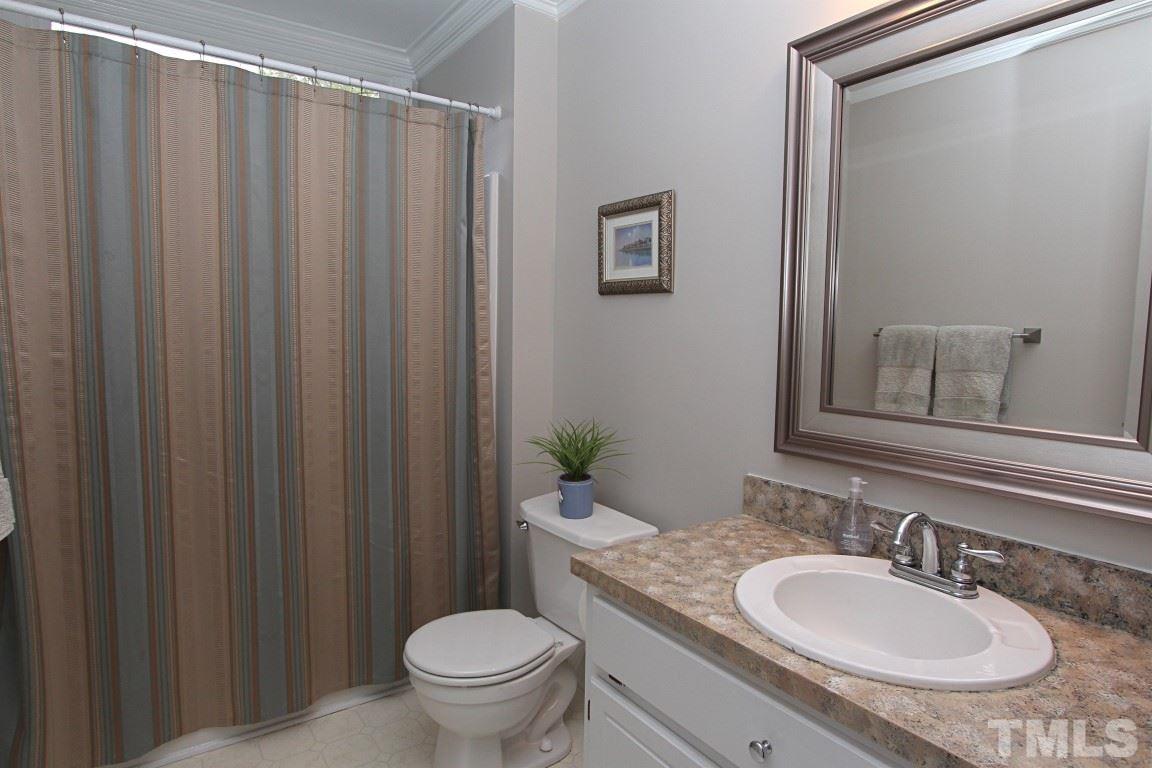 2720 Dahlgreen Road Raleigh, NC 27615 - Photo 14 of 25 a bathroom with a granite countertop sink toilet and a mirror
