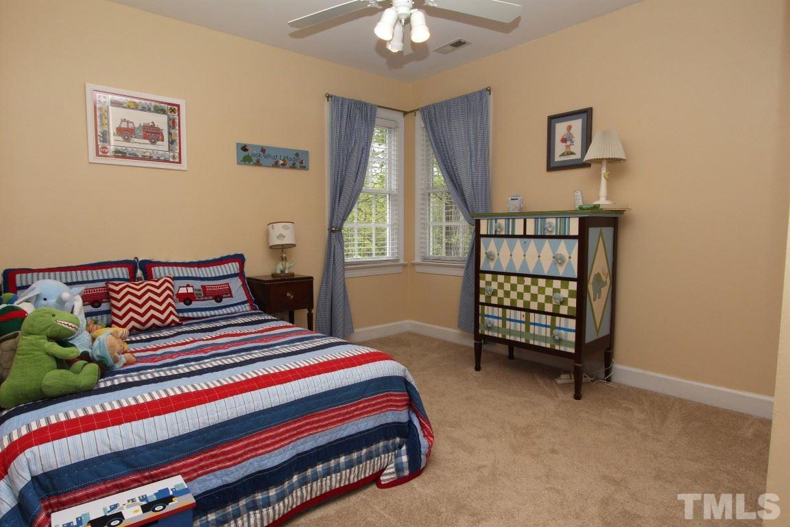 2720 Dahlgreen Road Raleigh, NC 27615 - Photo 15 of 25 a bedroom with a bed a painting on the wall and a window