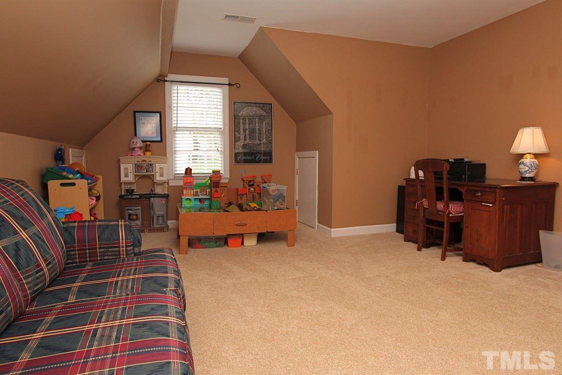 2720 Dahlgreen Road Raleigh, NC 27615 - Photo 16 of 25 a bed room with furniture and a window