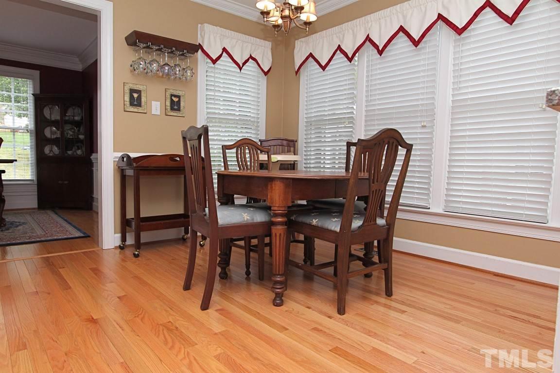 2720 Dahlgreen Road Raleigh, NC 27615 - Photo 4 of 25 a view of a dining room with furniture and wooden floor