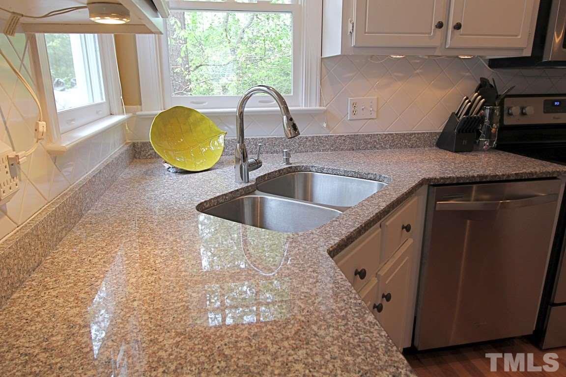 2720 Dahlgreen Road Raleigh, NC 27615 - Photo 5 of 25 a kitchen with a sink a counter and a window