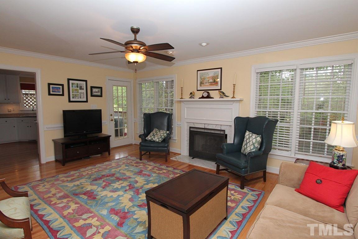 2720 Dahlgreen Road Raleigh, NC 27615 - Photo 7 of 25 a living room with furniture a flat screen tv and a fireplace