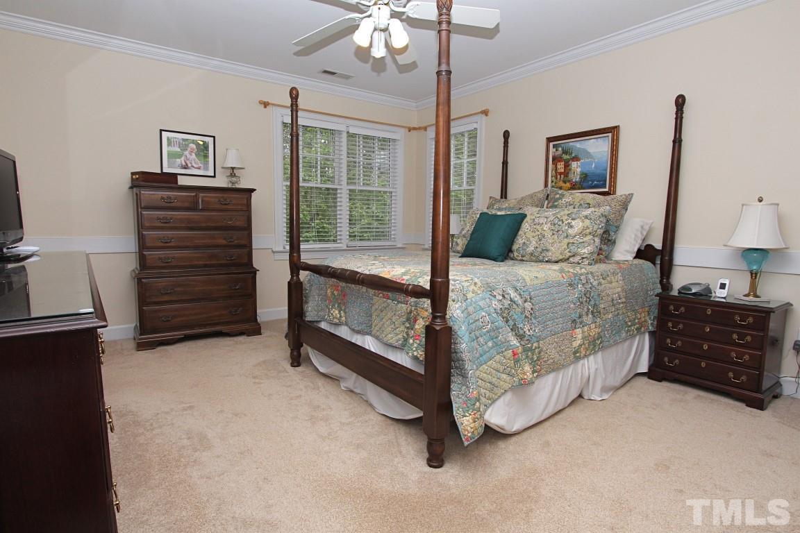 2720 Dahlgreen Road Raleigh, NC 27615 - Photo 10 of 25 a bedroom with a bed and a dresser