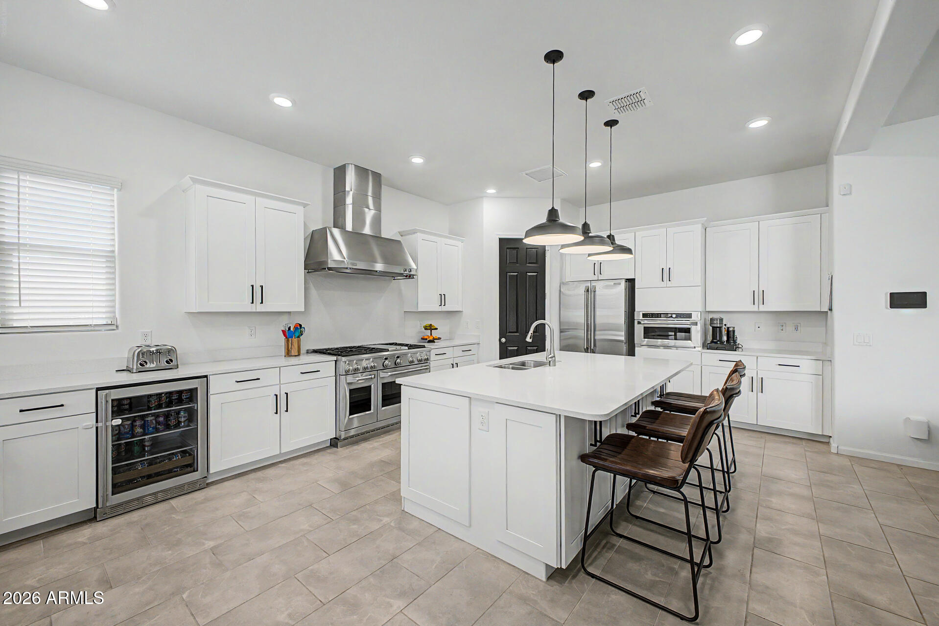 6511 West Steed Ridge Phoenix, AZ 85083 - Photo 10 of 41 a kitchen with kitchen island granite countertop a sink a stove a refrigerator and island with wooden floor